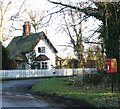 Postbox and wooden bench