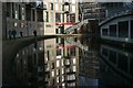 View of flats and Costa Coffee on Camden Road reflected in the Regent