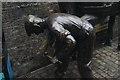 View of a bronze farrier statue in Camden Stables Market