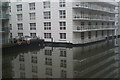 View of Gilbey House reflected in the Regents Canal