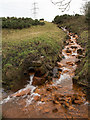 NZ1451 : Iron-stained stream at Stony Heap by Trevor Littlewood