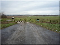 TA0779 : Gated farm track, West Flotmanby by JThomas