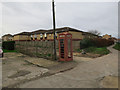 Battered phone box by Parson