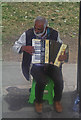 Street musician at bus stop