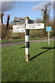 Signpost at crossroads beside B4020 at Delly Hill