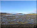 NR6549 : Low tide showing the beach near Ardminish by John Ferguson