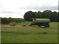 SE3728 : Water bowser and trough in a field off Fleet Lane by Graham Robson