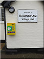 TM3067 : Defibrillator & Badingham Village Hall sign by Geographer