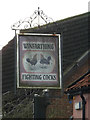 The Fighting Cocks Public House sign