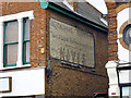TQ8486 : Old painted wall on former bakers, London Road by Robin Webster