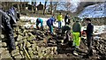 Repairing collapsed dry stone wall