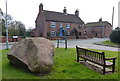 Millennium stone on a small green in Shelford