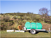 SO7646 : Trailer tank at foot of Table Hill by Trevor Littlewood