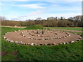 Ornamental Henge with wood behind