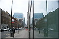 View of Aldgate Place reflected in the Student Castle student accommodation on Leman Street