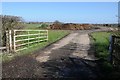 SP1042 : Field entrance and muck bury by Philip Halling