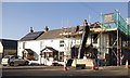 Repairing a roof at Farms Common