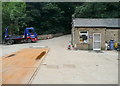 Footpath crossing a factory yard, Norland