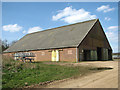 TF8509 : Unusual farm shed by Evelyn Simak