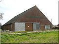 TG3506 : Large barn in Buckenham by Evelyn Simak