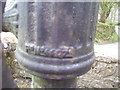 Wiston - old village pump in centre of road junction - detail