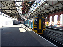 SH2482 : An Arriva Wales train stands in Holyhead station by John Lucas