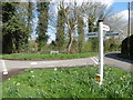 Triangular green at a road junction near Crowhurst Hop Farm