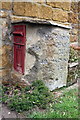 Old milestone and post box in front of Crickle Cottage, Stratford Road