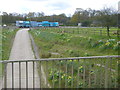 Access road to Holmbush Farm emerges from underpass