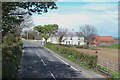 Farmhouse and buildings on the A2 near Quarter Road