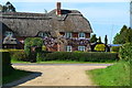 SU1410 : Thatched house opposite end of footpath by David Martin