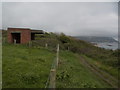 SY7481 : Ringstead: pillbox to the east of Bran Point by Chris Downer