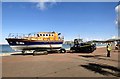 SH7882 : Lifeboat being towed off the promenade by Gerald England