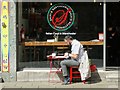 Customer at a pavement table