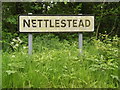 TM0949 : Nettlestead Village Name sign on Nettlestead Road by Geographer