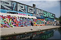 View of street art on the wall of a warehouse on the Hertford Union Canal towpath #5