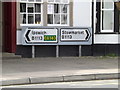 TM0854 : Roadsigns on the B1113 High Street by Geographer