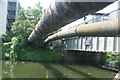 View of the Northern Outfall Sewer pipes crossing the River Lea from the River Lea towpath