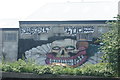 View of Sweet Tooth street art on the rear of a warehouse on the River Lea