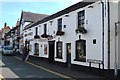 Putting the flags up at the Horse  & Jockey