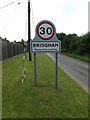 TL9585 : Bridgham Village Name sign on The Street by Geographer