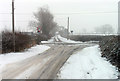 Klondyke Lane crosses Great Dalby Road on a snowy day