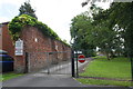 Brick wall at entrance to Larches House School from Larches Lane