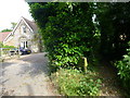 Footpath by house leads east from Priestwood Road