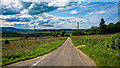 Looking west from the junction on the minor road near Knauchland