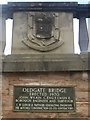 NZ1985 : Plaque and crest on Oldgate Bridge by Graham Robson