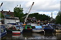 Jumble of boats and rubbish beside the Coventry Canal at Bedworth