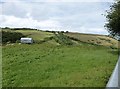 View from Woodhuish Lane up the hill to Southdown Barns