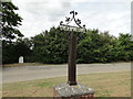 Scarning village sign and milestone in the layby