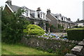 Pastel shades of houses and gardens by the A85 in Connel